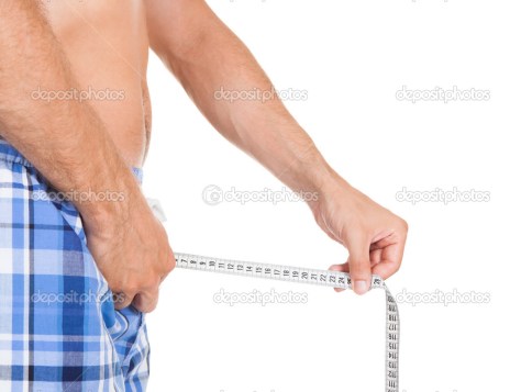Man measuring his penis size